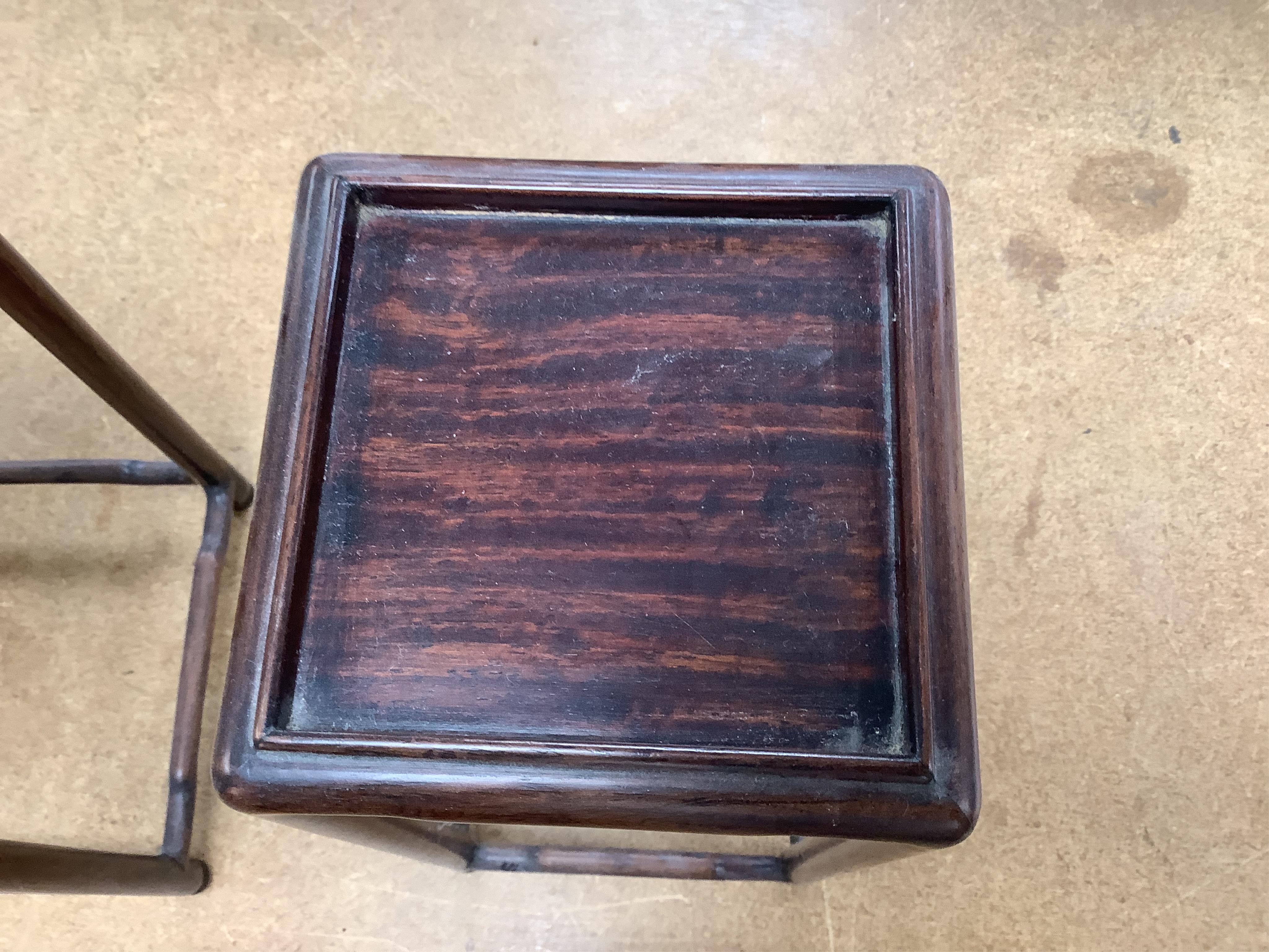 A nest of five Chinese hardwood stands, tallest (largest) 32cm high